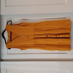 Sleeveless ruffle mustard yellow dress with botton detail